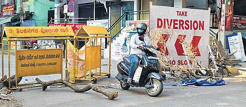 A biker passes through a barricade in Bengaluru on Wednesday | EXPRESS