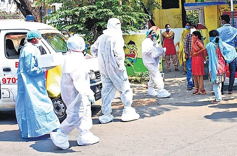 A mobile team shifting the collected samples at a ward secretariat in Visakhapatnam on Wednesday. (Photo | EPS)