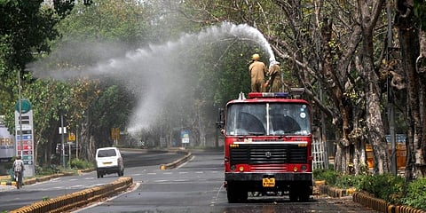 Fire Department staff sanitize the Mandir Marg area near Birla Mandir during the nationwide lockdown. (Photo | Anil Shakhya)