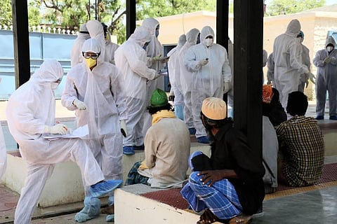 Healthcare workers take swab samples (Photo | PTI)