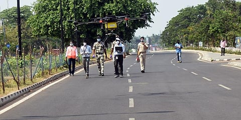 Disinfectant being spray through a drone from Rajmahal square to Sishu Bhawan square in Bhubaneswar. (Photo | Biswanath Swain, EPS)