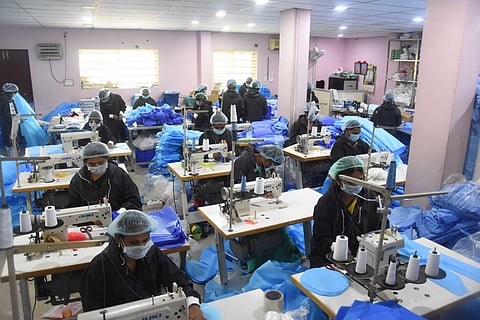 PPE kits are manufacturing at Madhuranagar in Vijayawada on Wednesday. (Photo| EPS/ P Ravindra Babu)