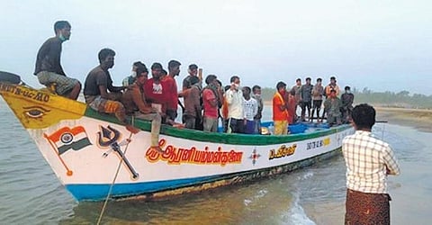The fishermen await permission for landing