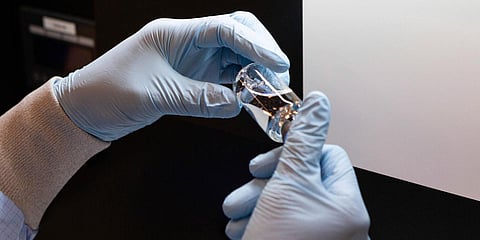 A vial of the investigational drug remdesivir is visually inspected at a Gilead Sciences manufacturing site in US. (Photo| AP)