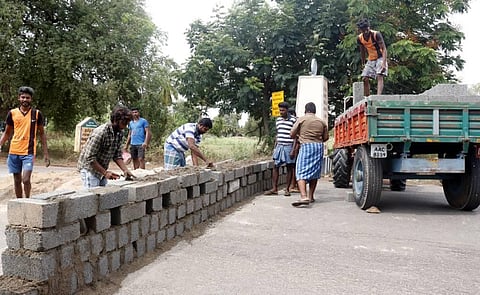 A three-feet wall has been raised across the road in Tamil Nadu-Andhra Pradesh border at Ponnai in Vellore district to block vehicle movement. Essential vehicles plying through this route will have to enter via Christianpet check post. (Photo | S Dinesh, 