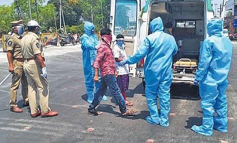 Lockdown violators being shifted to a quarantine centre in an ambulance,  in Vijayawada on Monday | EXPRESS