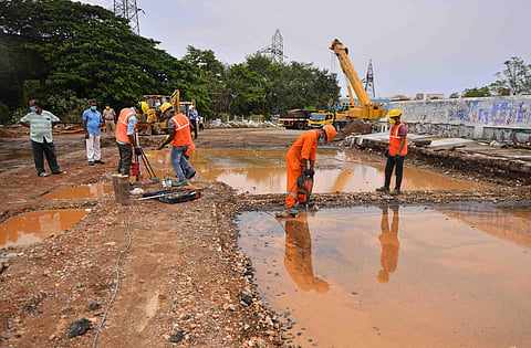 Railway workers making arrangements for demolishing the damaged Elephant Gate rail-over-bridge in the city on Sunday  | Debadatta Mallick