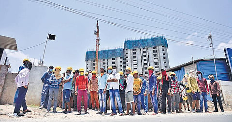 Migrant workers, mostly from Uttar Pradesh, Bihar, Odisha and West Bengal, protest outside a construction site along Chennai Bypass Road  (PHOTO | DEBADATTA MALLICK, EPS)