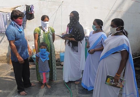 Asha workers and ANMs going door to door to collect information regaiding foreign returnees in view of Covid-19 at Singh Nagar in Vijayawada. (Photo| Prasant Madugala, EPS)