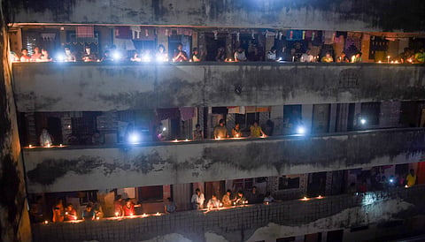 People light candles, lamps and flash mobile phones at a society to express the country's unity in fight against COVID-19, amid the nationwide lockdown.  (PTI photo used for representational purposes))