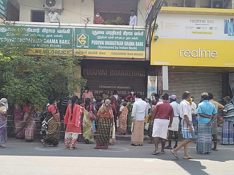 people have crowded in front of banks and  ATMs on MG Road. (Photo | EPS)