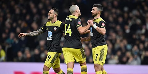 Southampton's Irish striker Shane Long (R) celebrates after he scores his team's first goal during the English FA Cup fourth round replay football match between Tottenham Hotspur and Southampton at Tottenham Hotspur Stadium in London. (File photo| AFP)