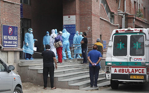 Medical staff wearing PPE kit stand at LNJP hospital in delhi during the nationwide lockdown on Sunday. (Photo| Anil Shakya, EPS)
