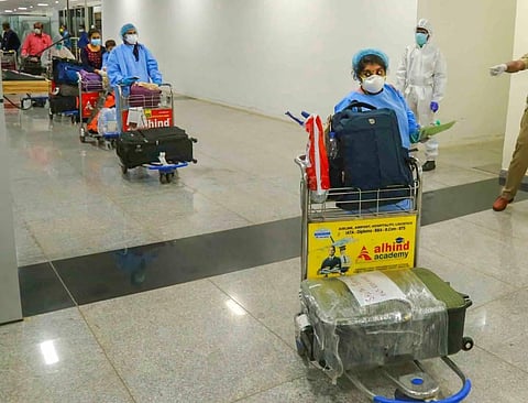 Passengers arrive from Kuwait by an Air India flight at Calicut International Airport during the ongoing COVID-19 lockdown in Kozhikode. (Photo | PTI)