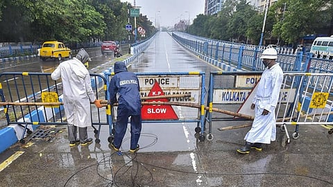 Police personnel seal Park Street flyover ahead of cyclone 'Amphan' landfall in Kolkata Wednesday. (Photo  | PTI)