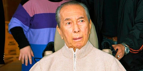In this March 6, 2010 photo, casino mogul Stanley Ho, wearing casual clothes and sneakers, is wheeled out of a Hong Kong hospital. (File Photo | AP)
