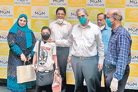 The 11-year-old boy with the team of doctors
