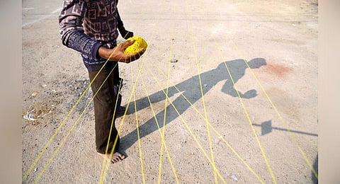 A man prepares manja thread. (File photo | File R Satish Babu, EPS)