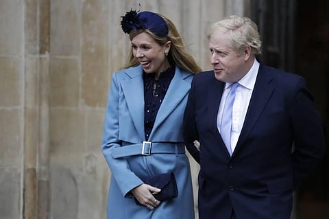 Britain's Prime Minister Boris Johnson and his partner Carrie Symonds arrive to attend the annual Commonwealth Day service at Westminster Abbey in London. (File photo | AP)