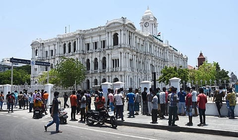 Hundreds of migrant workers gather at Ripon Building in Chennai to get a travel pass on Saturday. (Photo |  Ashwin Prasath, EPS)