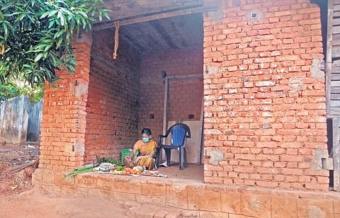 Latha B,  who has lost her job as a household worker following the pandemic, has set up a small vegetable stall attached to her home at Ukkodu in Vellayani to survive the lockdown  ,Vincent Pulickal