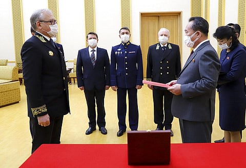 In this photo released by Russian Embassy in the DPRK/Russian Foreign Ministry Press Service on Tuesday, May 5, 2020, Russian Ambassador to Democratic People's Republic of Korea Alexander Matsegora, left, and Democratic People's Republic of Korea Foreign 