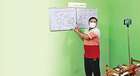PWD engineer Sudhir Kishore takes an online class on YouTube for Class 11 and Class 12 students during the lockdown.  (Photo | Shekhar Yadav, EPS)
