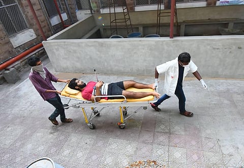 King George Hospital staff carrying one of the victims of Visakhapatnam gas tragedy (Photo |  G Satyanarayana, EPS)