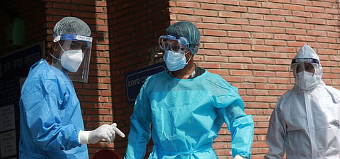 Medical professionals wearing PPE coveralls seen outside the Covid-19 ward at LNJP Hospital in New Delhi on Thursday.  (Photo | Shekhar Yadav/EPS)