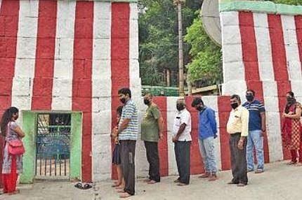 Devotees wait in a queue to enter a temple in Bengaluru | Nagaraja Gadekal
