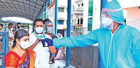 Srikalahasti temple employees being screened before they were allowed into the shrine for darshan on Monday (Photo | Madhav K, EPS)
