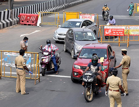 Police checking vehicle movement during the lockdown near Kilpauk Poonamallee High road in Chennai. (Photo | R Sathish Babu/EPS)