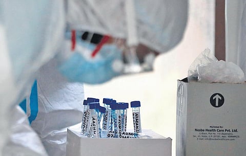 A healthcare worker collect samples of people for Covid-19 testing (Photo | Shekhar Yadav, EPS)