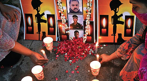 Citizens stage a candlelight vigil paying tribute to the 20 Indian Army soldiers who were martyred in the recent conflict with the Chinese Army, in Bengaluru on Wednesday | vinod kumar t