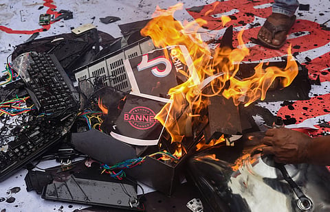 Youth Congress activists burn Chinese products during a protest. (Photo | PTI)