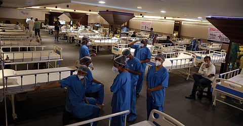 Medics at the Shehnai Banquet Hall that has been temporarily converted into an isolation centre for COVID-19 patients in New Delhi on Wednesday. (Photo | Shekhar Yadav/EPS)
