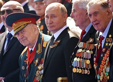 Russian President Vladimir Putin, center, watches the Victory Day military parade marking the 75th anniversary of the Nazi defeat in Moscow. (File photo | AP)