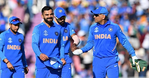 India's captain Virat Kohli (2L) with  Mahendra Singh Dhoni (R). (Photo | AFP)