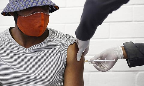 In this Wednesday, June 24, 2020 file photo, a volunteer receives a COVID-19 test vaccine injection developed at the University of Oxford in Britain, at the Chris Hani Baragwanath hospital in Soweto, Johannesburg, South Africa. (Photo | AP)