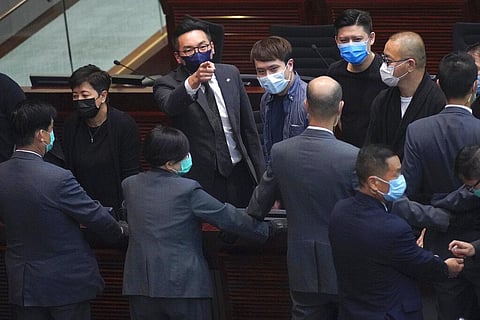 Pro-democracy lawmakers protest at the main chamber of the Legislative Council in Hong Kong, Thursday, June 4, 2020. Hong Kong’s legislature approved a contentious bill Thursday that makes it illegal to insult the Chinese national anthem. The legislation 