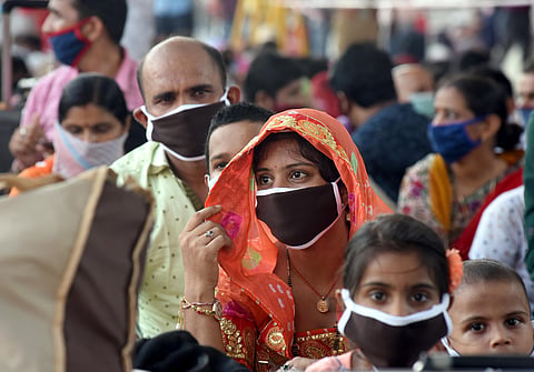 Migrants from Rajasthan wait to board a special train to reach Jodhpur at Central railway station in Chennai on Friday.  (Photo | Martin Louis/EPS)