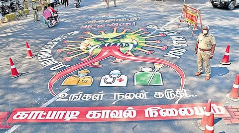A Covid-19 awareness message painted on the road in Katpadi | S Dinesh
