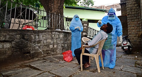 A health worker collecting swab sample. (Photo | EPS/Shriram BN)