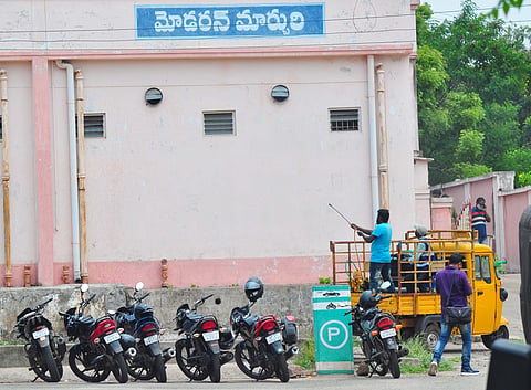 GVMC staff sprinkled disinfectants at KGH mortuary in Visakhapatnam. (Photo | G Satyanarayana, EPS)