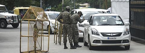 Marshals check ID  cards of visitors at  the BBMP head office  | vinod Kumar T