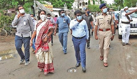 Collector I Samuel Anand Kumar, SP RN Ammi Reddy and GMC Commissioner  C Anuradha inspect containment zones in Guntur city on Friday | Express
