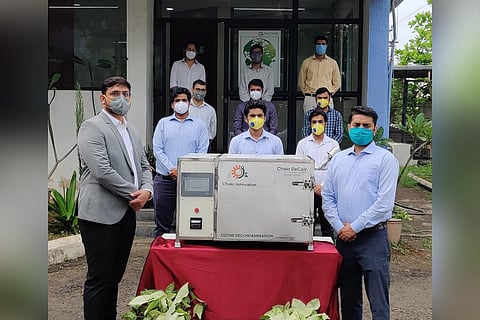 Officials of Chakra Innovation with  Chakr DeCoV device. (Photo | EPS)