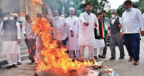 Congress Committee Minorities Wing activists burn the effigy of Chief Minister K Chandrasekhar Rao at Gandhi Bhavan in Hyderabad on Saturday, against the demolition of two mosques and a temple at the Secretariat complex