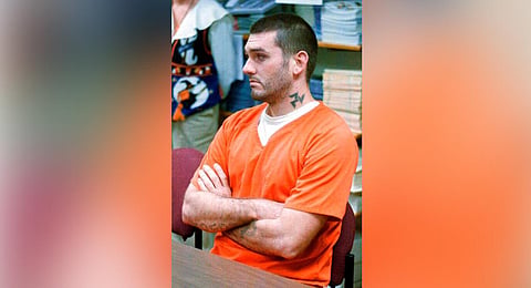 In this Oct. 31 1997 file photo Danny Lee waits for his arraignment hearing for murder in the Pope County Detention Center in Russellville, Ark. A federal judge in Indiana on Friday, July, 10, 2020, halted the first federal execution planned in 17 years s