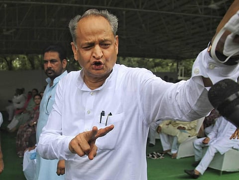 Rajasthan Chief Minister Ashok Gehlot flashes victory sign during a meeting with the party MLAs at his residence in Jaipur Monday July 13 2020. (Photo | PTI)